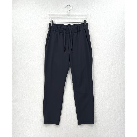 lululemon athletica Pants - LULULEMON On The Fly Woven 27" Pants Womens 6 Dark Navy Cropped Slim Straight